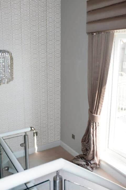 Curtain drapes in a stairwell in an interior design project in Chatsworth Road